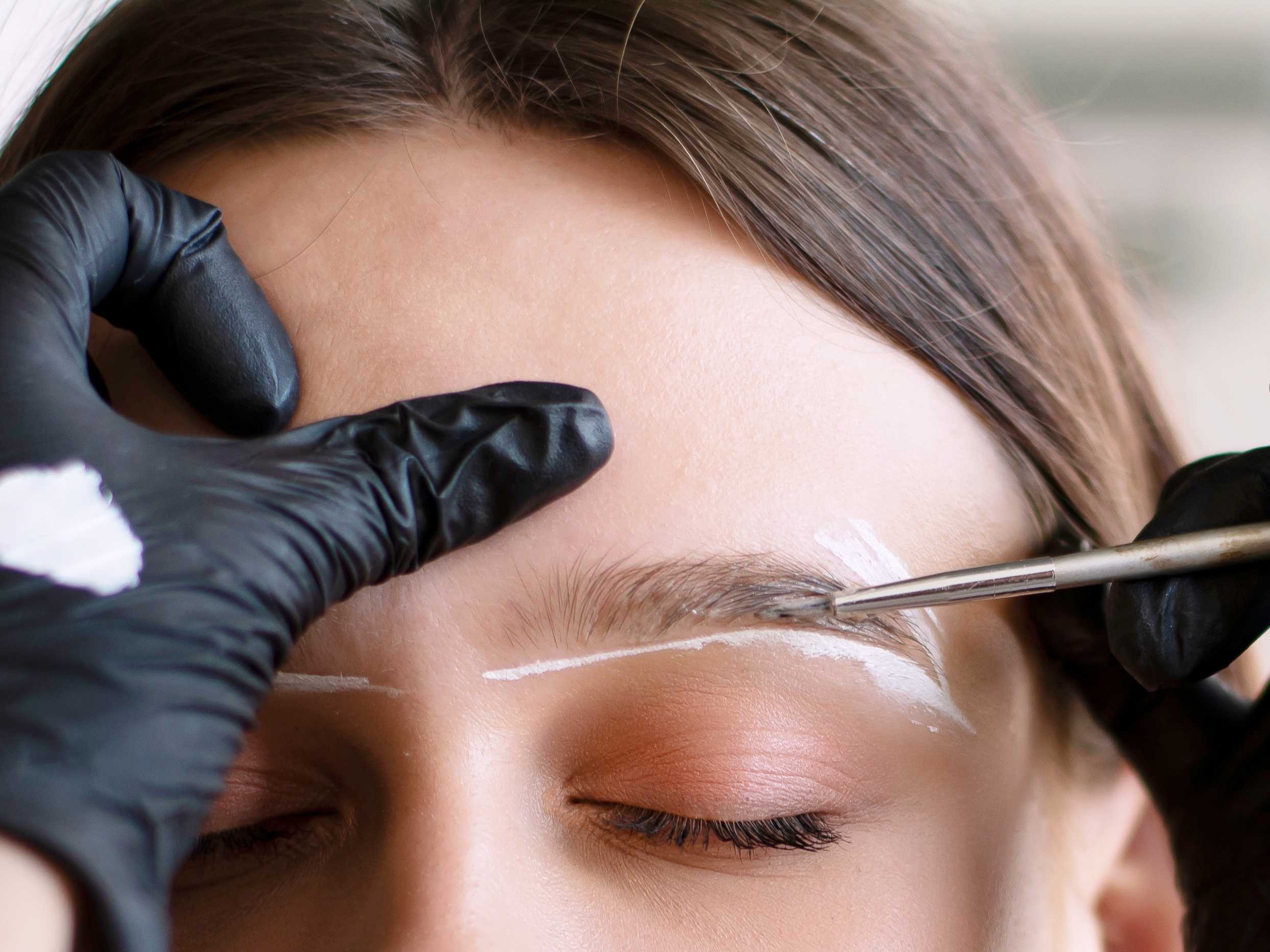 young-woman-undergoing-eyebrow-correction-procedur-2021-10-16-17-37-11-utc